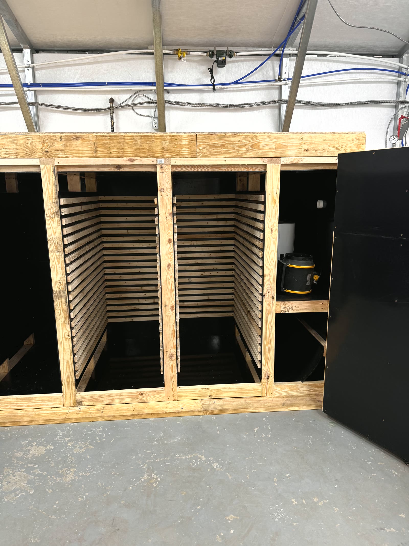 Carolina Cordys custom dryer exterior — four chambers, handbuilt from scratch on the North Carolina farm